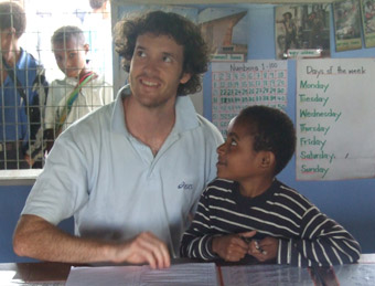 Palms Australia volunteer Damien Beale with sign language student Anna in Papua New Guinea