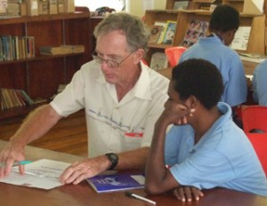 Palms Australia volunteer Des Hansen with student at Sacred Heart College in Papua New Guinea