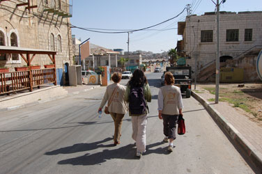 Two EAs and a coordinator in a part of Hebron inhabited by settlers