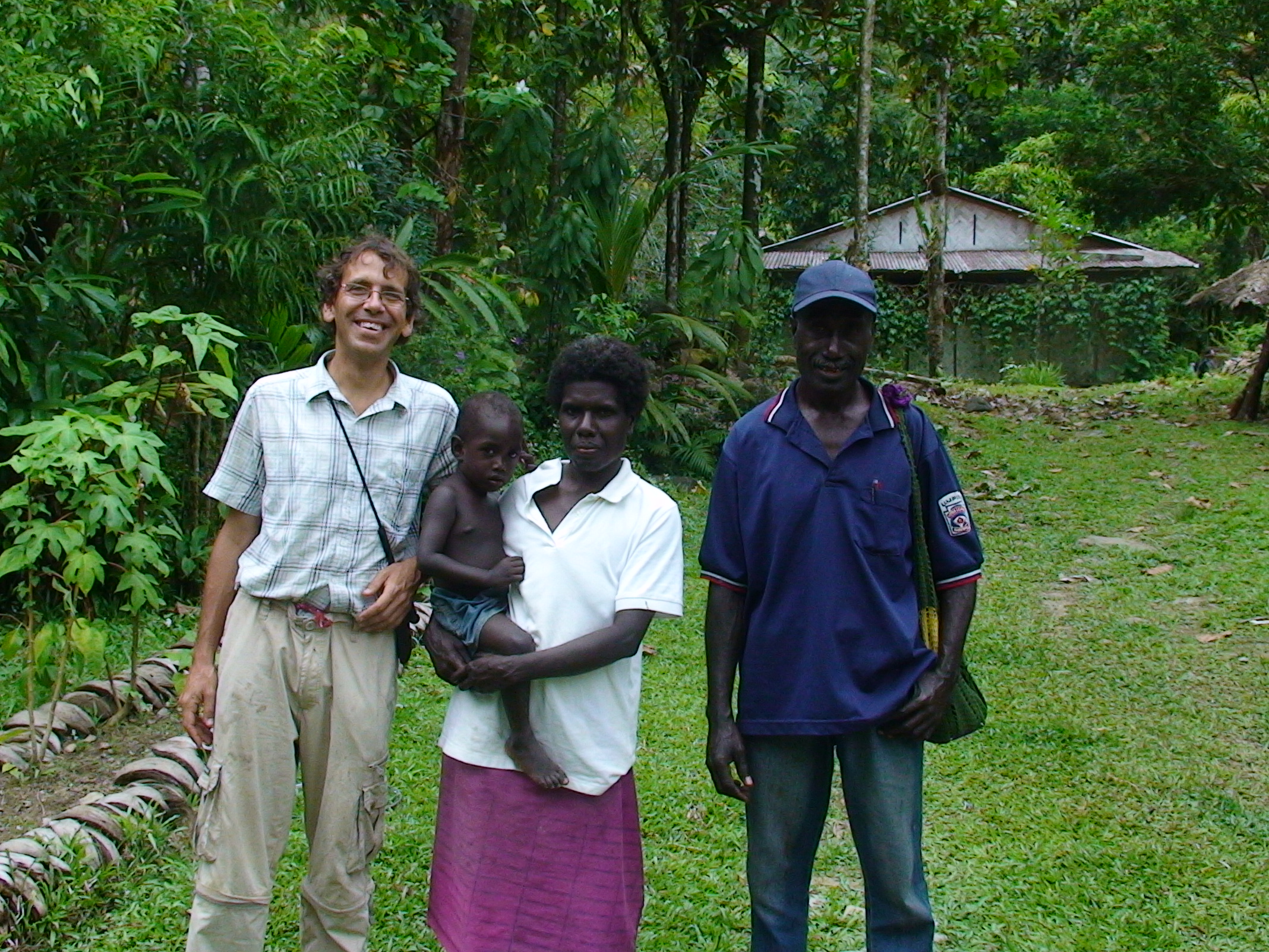 Palms Australia volunteer Kevin Wilson with Mary and Cletus from Domakoo community school