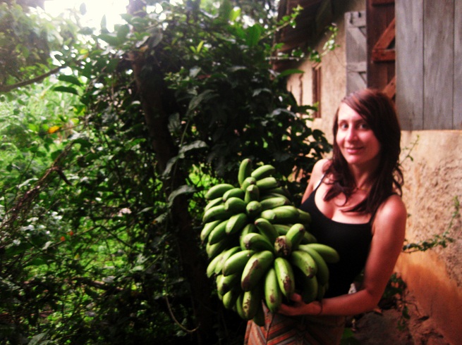 Palms Australia volunteer Elly with a small bunch of Matoke (food staple in Uganda)