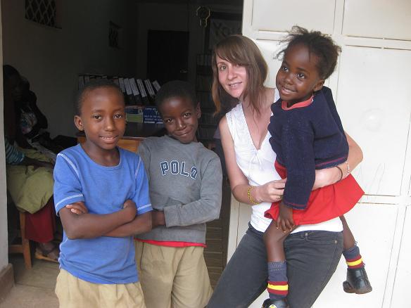 Elly with children in Uganda