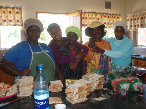 Fran's colleagues preparing food in South Africa