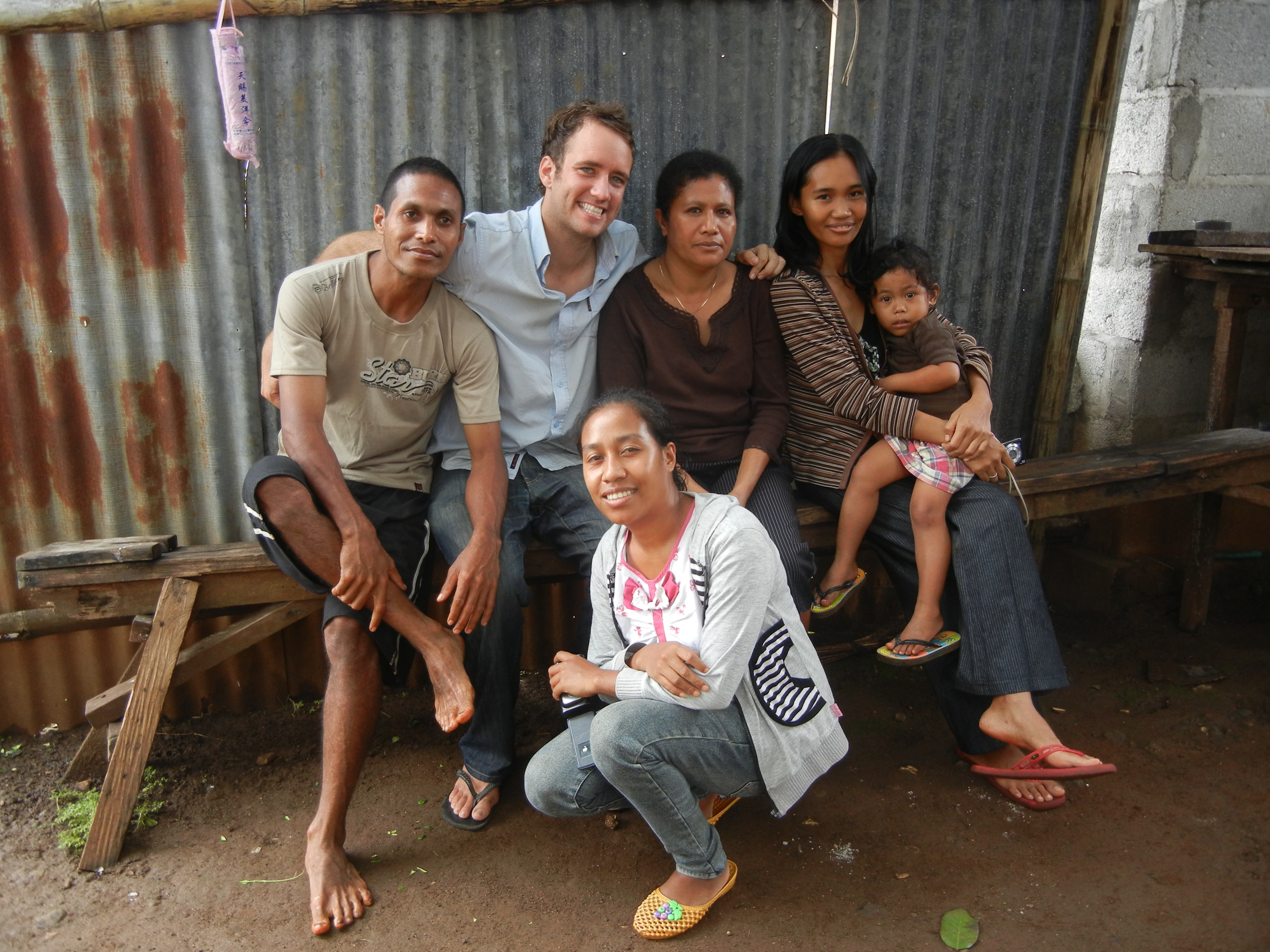 Palms Australia volunteer Heath Thompson with Timorese family