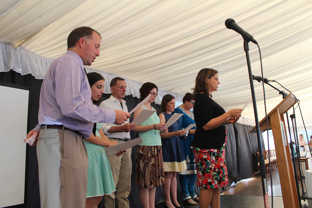 Palms volunteers recite the Participant Pledge at the Solidarity Awards
