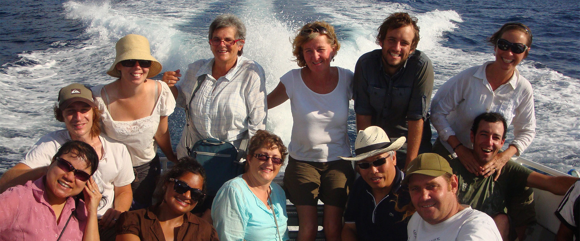 Group of Encounter participants on a boat in Timor-Leste