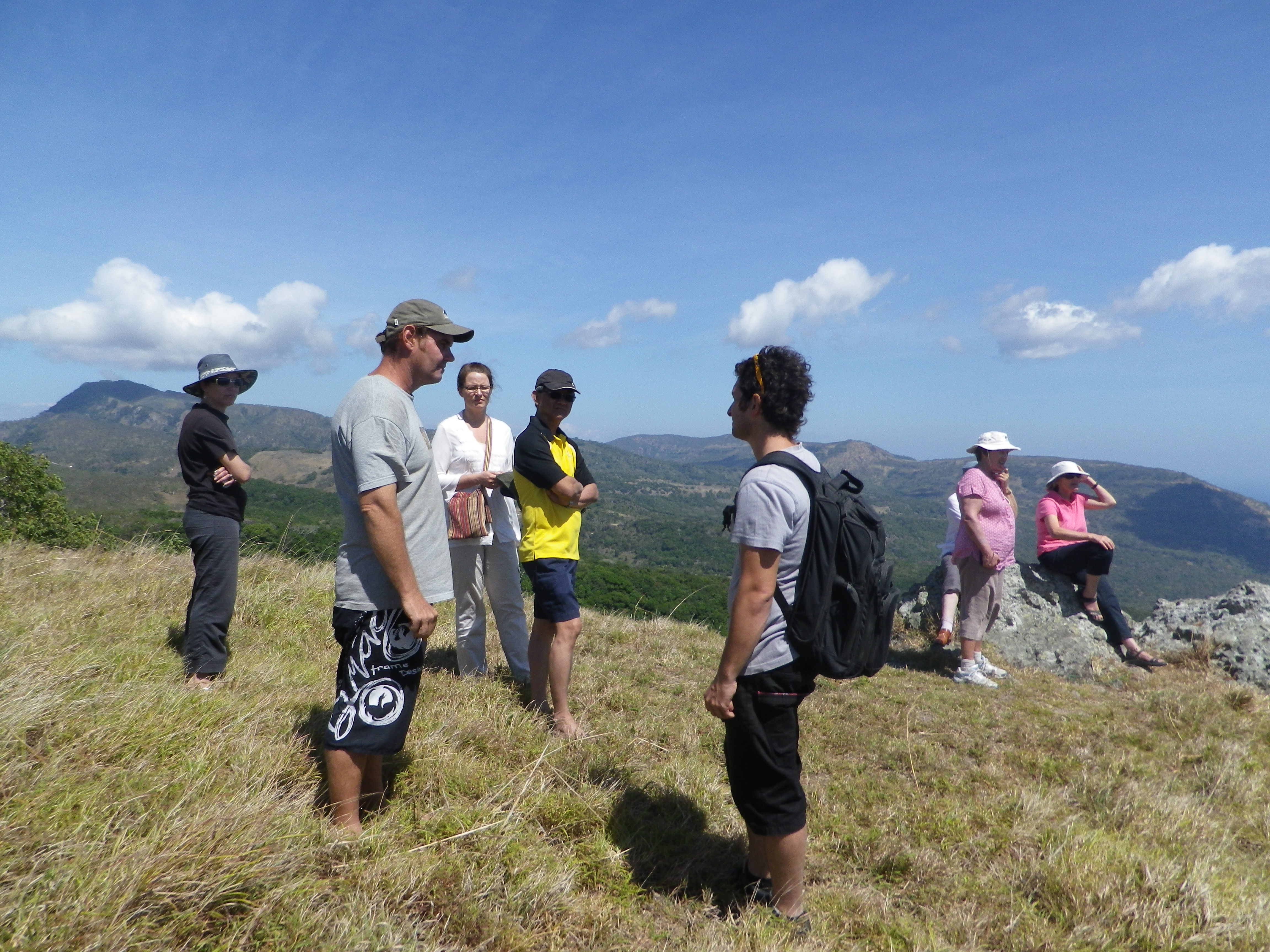 Group of Timor Leste encounter participants standing on a mountain