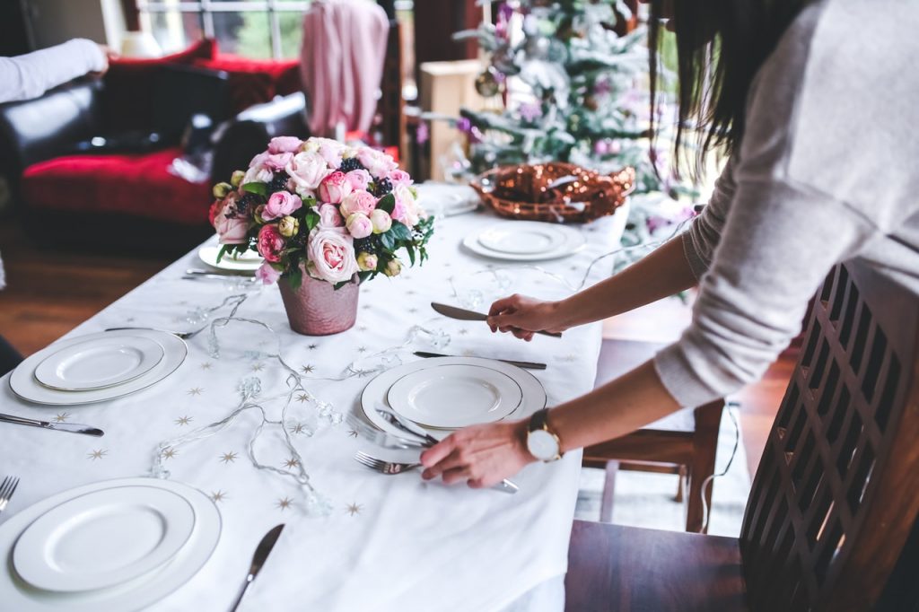 Woman setting festive table