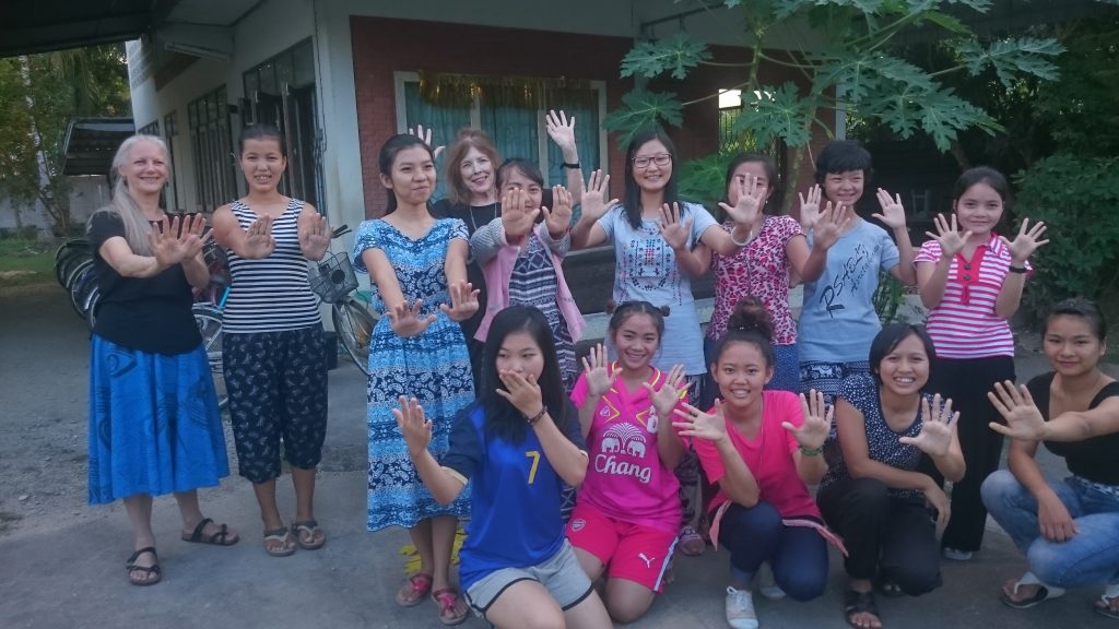 Christine with volunteer Rosaleen and her female students in Mae Sot, Thailand.