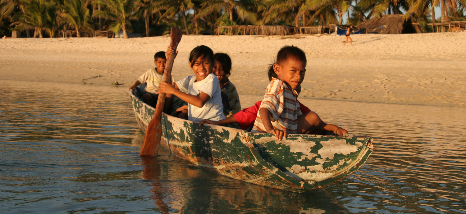 Children in canoe in Rote, Indonesia