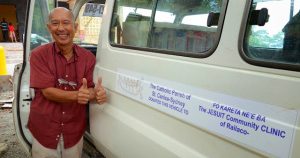 Fr Martin Abad Santos S.J. with the Mobile Clinic Van